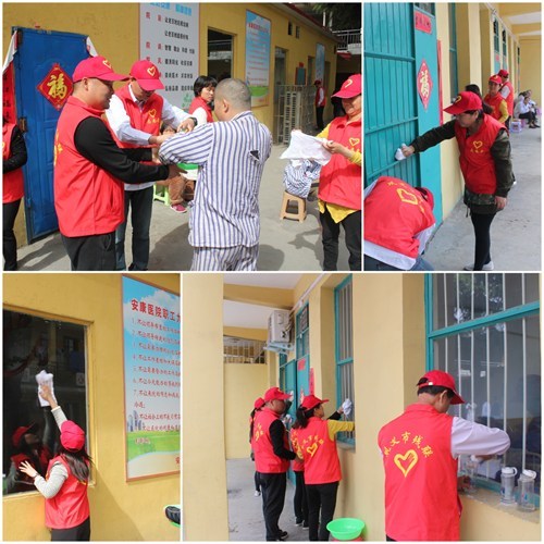图为志愿者在擦窗户 图为志愿者在擦窗户
